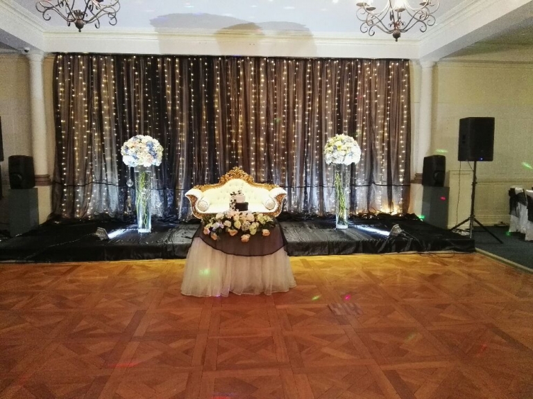Community hall event styling entrance and stage decorations