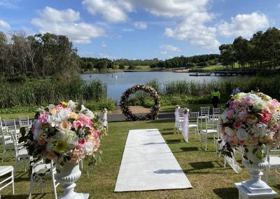 wedding ceremony aisle flower urns