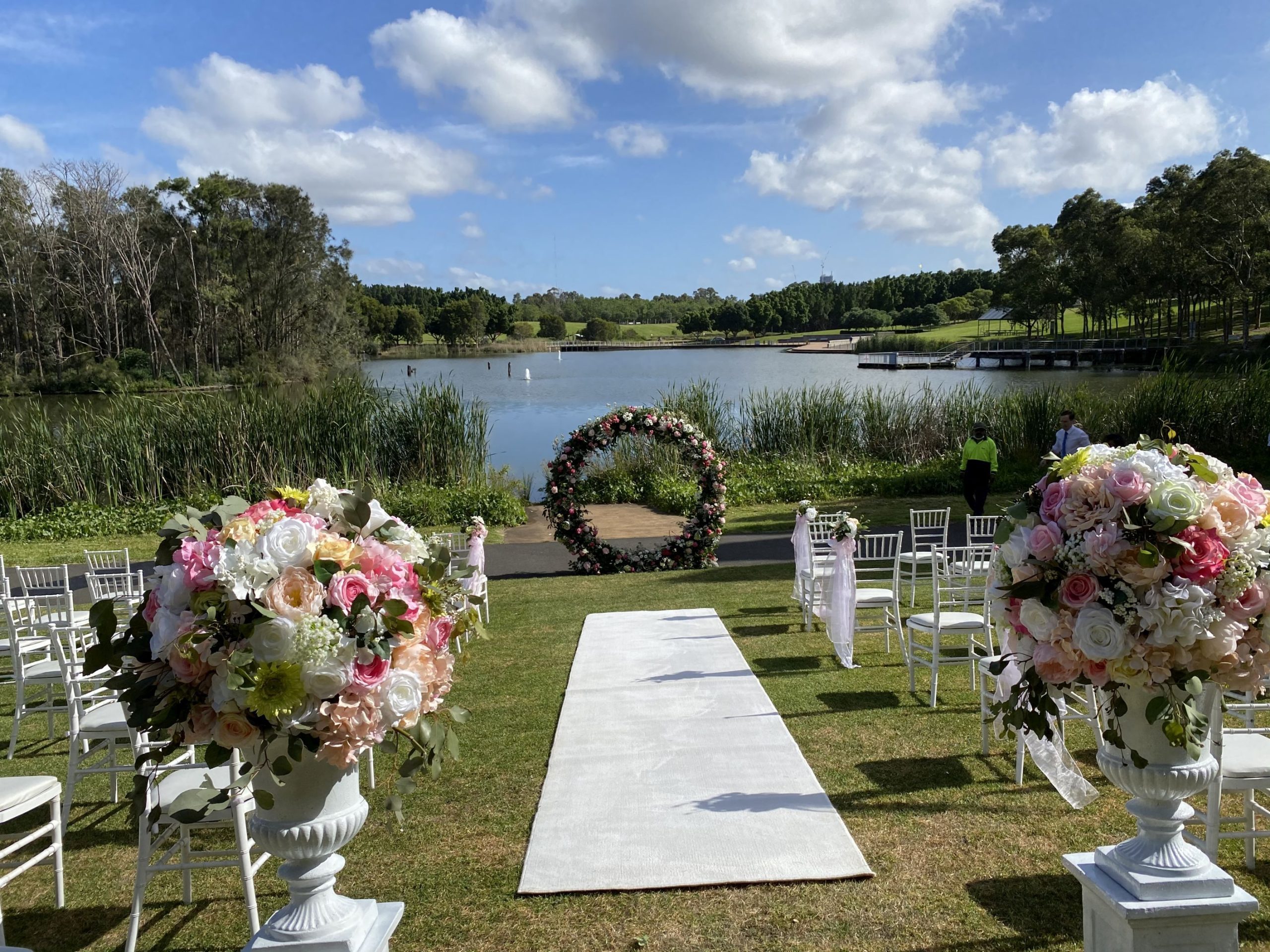 wedding ceremony aisle flower urns