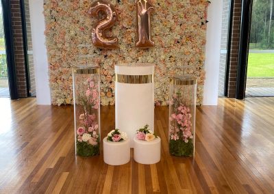 21 flower backdrop with floral plinth displays